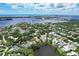 Waterfront community with upscale homes and lush landscaping at 4431 Camino Real, Sarasota, FL 34231