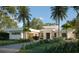 Modern home with clean lines and attractive landscaping at 4431 Camino Real, Sarasota, FL 34231