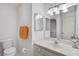 Bathroom featuring a single vanity, framed mirror, decorative lighting, and white walls at 4565 Mohican Trl # 129, Sarasota, FL 34233