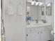 Clean bathroom featuring a vanity with storage and well-lit mirror at 4565 Mohican Trl # 129, Sarasota, FL 34233