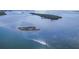 Aerial photo of open water featuring islands surrounded by crystal clear blue water at 4607 Mangrove Point Rd, Bradenton, FL 34210