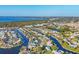 Scenic aerial view of waterfront homes in a canal community with access to bay at 4607 Mangrove Point Rd, Bradenton, FL 34210