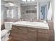 Bathroom featuring modern vanity and a shower with decorative accent tiles at 4607 Mangrove Point Rd, Bradenton, FL 34210