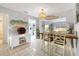 Bright dining area with stylish light fixture, wine rack, and views of the outdoor space at 4607 Mangrove Point Rd, Bradenton, FL 34210