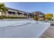 Waterfront home featuring a screened-in patio area, a concrete patio, and a dock at 4607 Mangrove Point Rd, Bradenton, FL 34210