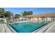 Sparkling community pool featuring pristine blue water, comfortable seating, and a relaxing atmosphere at 4616 Park Acres Dr, Bradenton, FL 34207