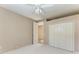 This bedroom offers a ceiling fan, a closet, and a door to another room at 4749 Antler Trl, Sarasota, FL 34238