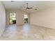 Bright, empty bedroom boasts high ceilings, tile floor and an abundance of natural light at 4749 Antler Trl, Sarasota, FL 34238