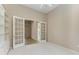 Bright bedroom with french doors leading to an additional room at 4749 Antler Trl, Sarasota, FL 34238