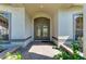 Elegant front entrance with double doors, brick pavers, and well-maintained landscaping at 4749 Antler Trl, Sarasota, FL 34238