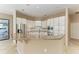 Kitchen featuring white cabinets, granite countertops, and stainless steel appliances at 4749 Antler Trl, Sarasota, FL 34238