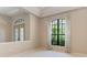 Bright living room with large window and double door front entrance at 4749 Antler Trl, Sarasota, FL 34238