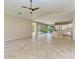 Spacious living room with tile floors, vaulted ceiling and view of the pool at 4749 Antler Trl, Sarasota, FL 34238