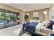 Stylish main bedroom with pool view through glass doors and contemporary decor at 4749 Antler Trl, Sarasota, FL 34238