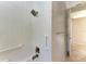 Modern walk-in shower with tiled walls, grab bars and rainfall shower head at 4749 Antler Trl, Sarasota, FL 34238