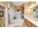 Large bathroom with double vanity, tub, and shower at 4921 Woodhurst Dr, Sarasota, FL 34243