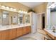 Elegant bathroom with double vanity, soaking tub, and walk-in shower at 4921 Woodhurst Dr, Sarasota, FL 34243