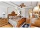 Main bedroom with ornate bed frame and hardwood floors at 4921 Woodhurst Dr, Sarasota, FL 34243