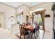 Formal dining room with elegant chandelier and access to outdoor patio at 4921 Woodhurst Dr, Sarasota, FL 34243