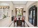 Formal dining room with large windows and chandelier at 4921 Woodhurst Dr, Sarasota, FL 34243