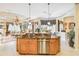 Large kitchen island with granite countertop and stainless steel dishwasher at 4921 Woodhurst Dr, Sarasota, FL 34243