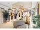 Living room with built-in shelving, fireplace, and hardwood floors at 4921 Woodhurst Dr, Sarasota, FL 34243