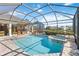 Relaxing screened-in pool and spa; perfect for outdoor entertaining at 4921 Woodhurst Dr, Sarasota, FL 34243