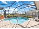 Inviting screened pool with spa and open-air feel at 4921 Woodhurst Dr, Sarasota, FL 34243