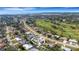 Aerial view of a lovely home in a golf course community near the water at 512 Whitfield Ave, Sarasota, FL 34243