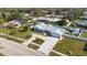 Aerial view of home on a well-maintained lot, with a manicured garden and large driveway at 512 Whitfield Ave, Sarasota, FL 34243