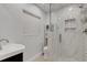 Modern bathroom with a walk-in shower and white tile at 512 Whitfield Ave, Sarasota, FL 34243