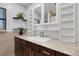 Clean bathroom with white vanity, granite countertop and mirrored cabinet at 512 Whitfield Ave, Sarasota, FL 34243