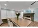 Bright dining room with wood table and stone fireplace at 512 Whitfield Ave, Sarasota, FL 34243