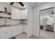 White kitchen with granite countertops and ample cabinet space at 512 Whitfield Ave, Sarasota, FL 34243