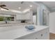 Kitchen features white cabinets and modern appliances at 512 Whitfield Ave, Sarasota, FL 34243