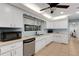 White kitchen with stainless steel appliances at 512 Whitfield Ave, Sarasota, FL 34243