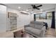 Living area with gray sectional sofa and built in shelving at 512 Whitfield Ave, Sarasota, FL 34243