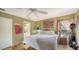 Bright bedroom with hardwood floors and access to a private patio at 5180 Meldon Cir, Sarasota, FL 34232