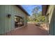 Wooden deck features outdoor furniture and a tranquil view of the expansive yard at 5180 Meldon Cir, Sarasota, FL 34232