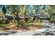 House exterior with red shutters and a circular driveway at 5180 Meldon Cir, Sarasota, FL 34232