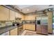 Modern kitchen with stainless steel appliances and granite countertops at 5180 Meldon Cir, Sarasota, FL 34232