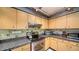 Modern kitchen with stainless steel appliances and granite countertops at 5180 Meldon Cir, Sarasota, FL 34232