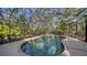 The backyard features a screened-in pool with waterfall feature at 5180 Meldon Cir, Sarasota, FL 34232