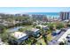 Aerial view of community, pond, and oceanfront at 527 Sutton Pl # T-12, Longboat Key, FL 34228