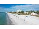 Beachfront property, aerial view showing beach and building at 527 Sutton Pl # T-12, Longboat Key, FL 34228