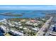 Aerial view of community near water with roadway at 527 Sutton Pl # T-12, Longboat Key, FL 34228