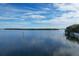 Aerial view of waterfront property with calm water and lush greenery at 527 Sutton Pl # T-12, Longboat Key, FL 34228