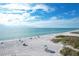 Beachfront property aerial view, showing beachgoers at 527 Sutton Pl # T-12, Longboat Key, FL 34228