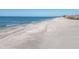 Long sandy beach with ocean view at 527 Sutton Pl # T-12, Longboat Key, FL 34228