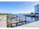 Wooden walkway leads to community boat docks on the water at 527 Sutton Pl # T-12, Longboat Key, FL 34228